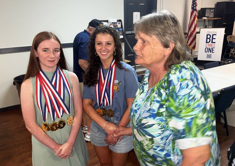 JASON MARTIN/Special Nancy Messinger, member of American Legion Post 90 Auxiliary, right, talks with Emma Allen, center, and Katlyn Sullivan at the Aug. 2 cookout at the Post headquarters in Statesboro.