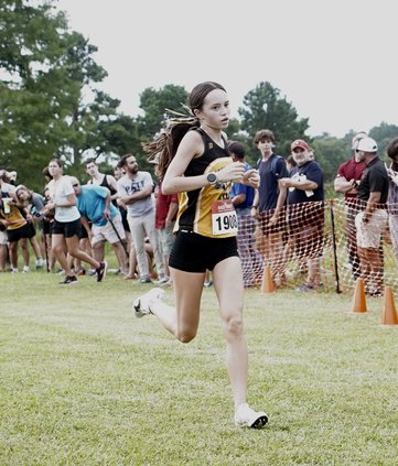 Gabriella Francis coming in second with a time of 20:23.99.