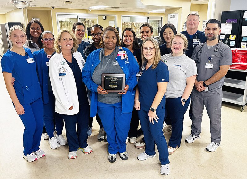 Courtesy Esat Georgia Regional Medical Center April Employee of the month Angelia “Angie” Morris, CNA/Unit Secretary, ICU/CCU/Critical Care, stands with her Critical Care Unit team.
