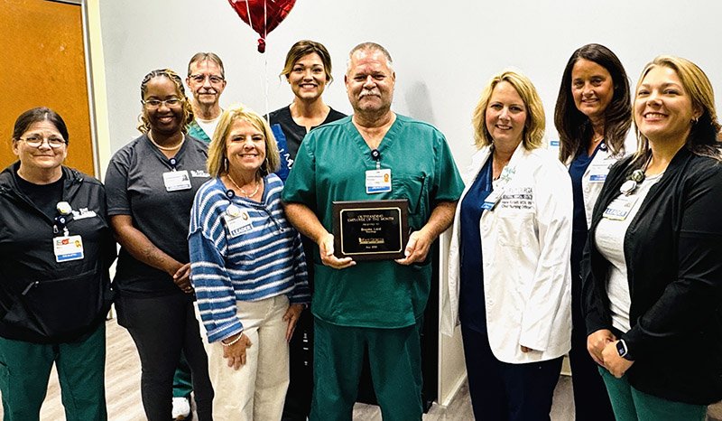 Courtesy Esat Georgia Regional Medical Center May Employee of the month Brooks Lord, CT Technologist, stands with his Radiology team.