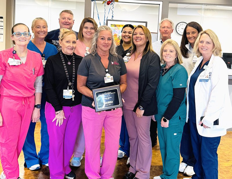 Courtesy East Georgia Regional Medical Center June Employee of the month Renée Durfee, RT(R)(M), Mammography Technologist, stands with her Imaging Center and EGRMC team.
