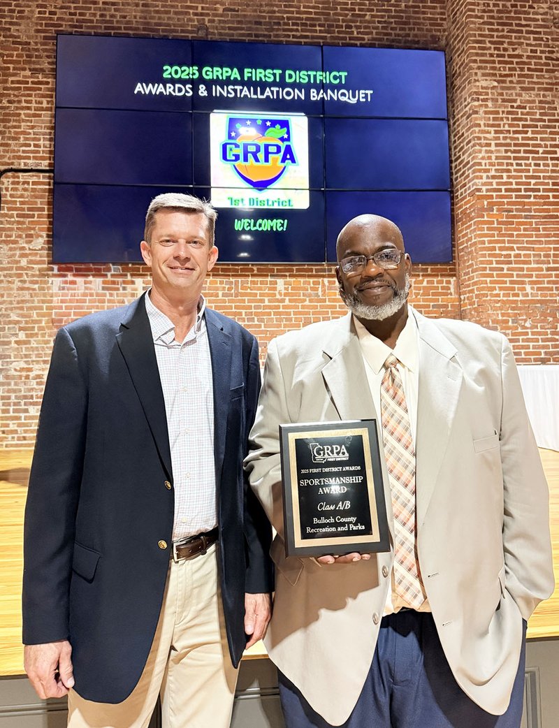 Bulloch County Recreation and Parks Director Dadrian Cosby, right, holds the Sportsmanship Award.