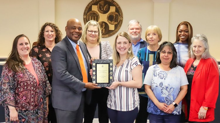 Members of the city’s finance team pictured in 2023 alongside the Statesboro City Council after receiving recognition for its 2021 ACFR.