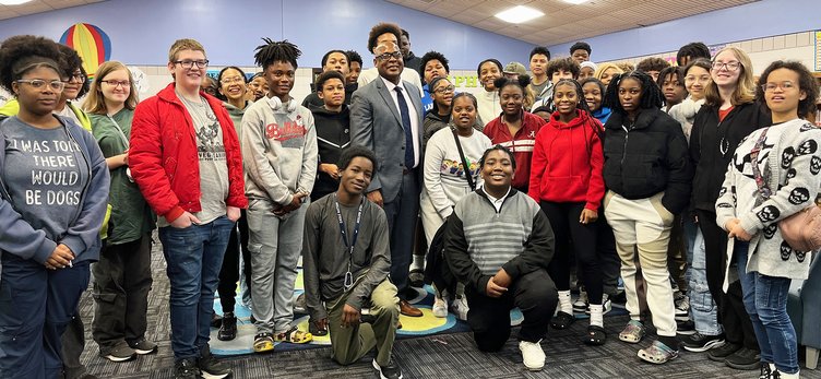 Photos Courtesy Langston Chapel Middle School Statesboro Mayor Johnathan McCollar, center in coat and tie, joined an 8th-grade class at Langston Chapel Middle School for a discussion about the city and his views on the future direction of Statesboro.