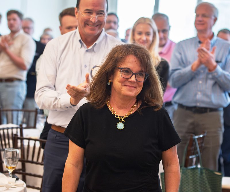 Keely Nesmith Fennell receives a round of applause as she make her way to the podium after being named the 2025 Citizen of the Year by the Rotary Club of Statesboro and The Rotary Club of Downtown Statesboro at Forest Heights Country Club on Wednesday, Ap