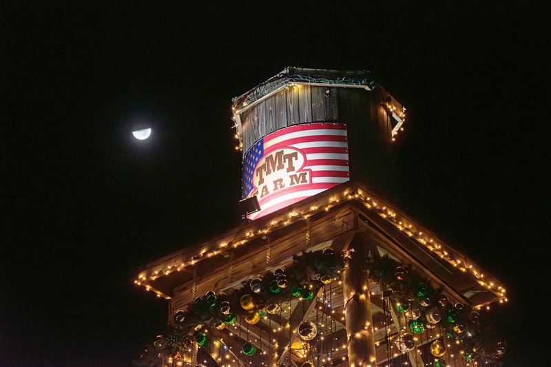 with a half-moon lighting the night sky, TMT Farms Christmas lights shine one last time.