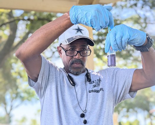 A volunteer with “Safe Water Together for Brunswick” tests water as part of a program organized by Georgia Southern University’s Institute for Water and Health.