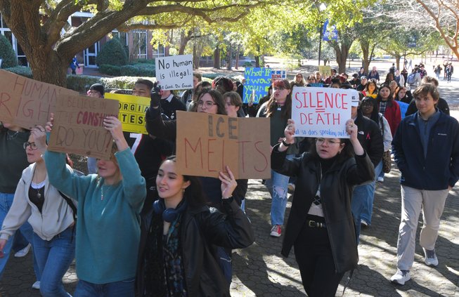 Marchers make their way to the south end of Georgia Southern's campus during Wednesday's protest against ICE and current U.S. immigration enforcement policies.