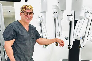 Photo Courtesy East Georgia Regional Medical Center Thomas Sorbera, M.D., a urologist with East Georgia Urology, is photographed with the robotic equipment that allows precise removal of prostate tissue.
