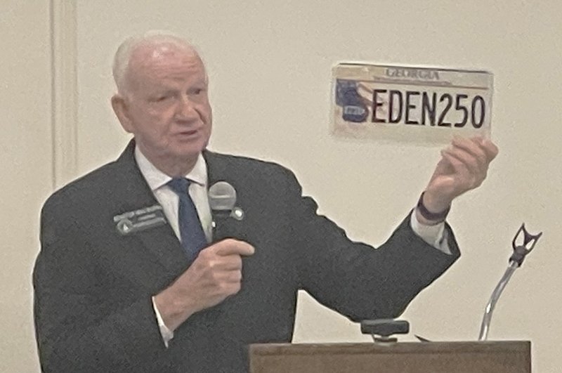 State Senator Max Burns shows the new Georgia Tag honoring the United States 250th Anniversary year.