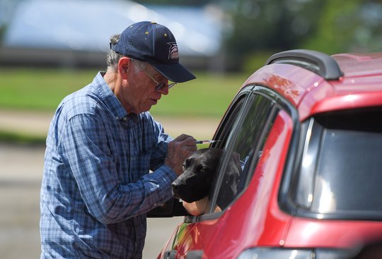 Pets line up for mobile rabies clinic